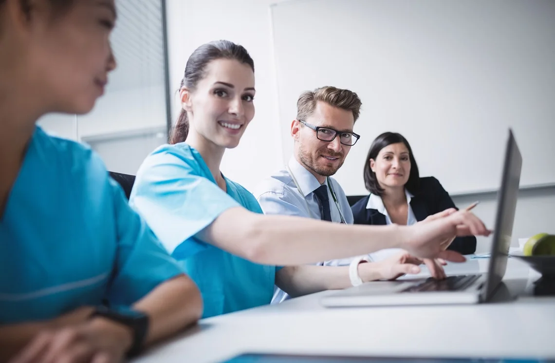 Physician viewing the impacts of connected care on her patient population.