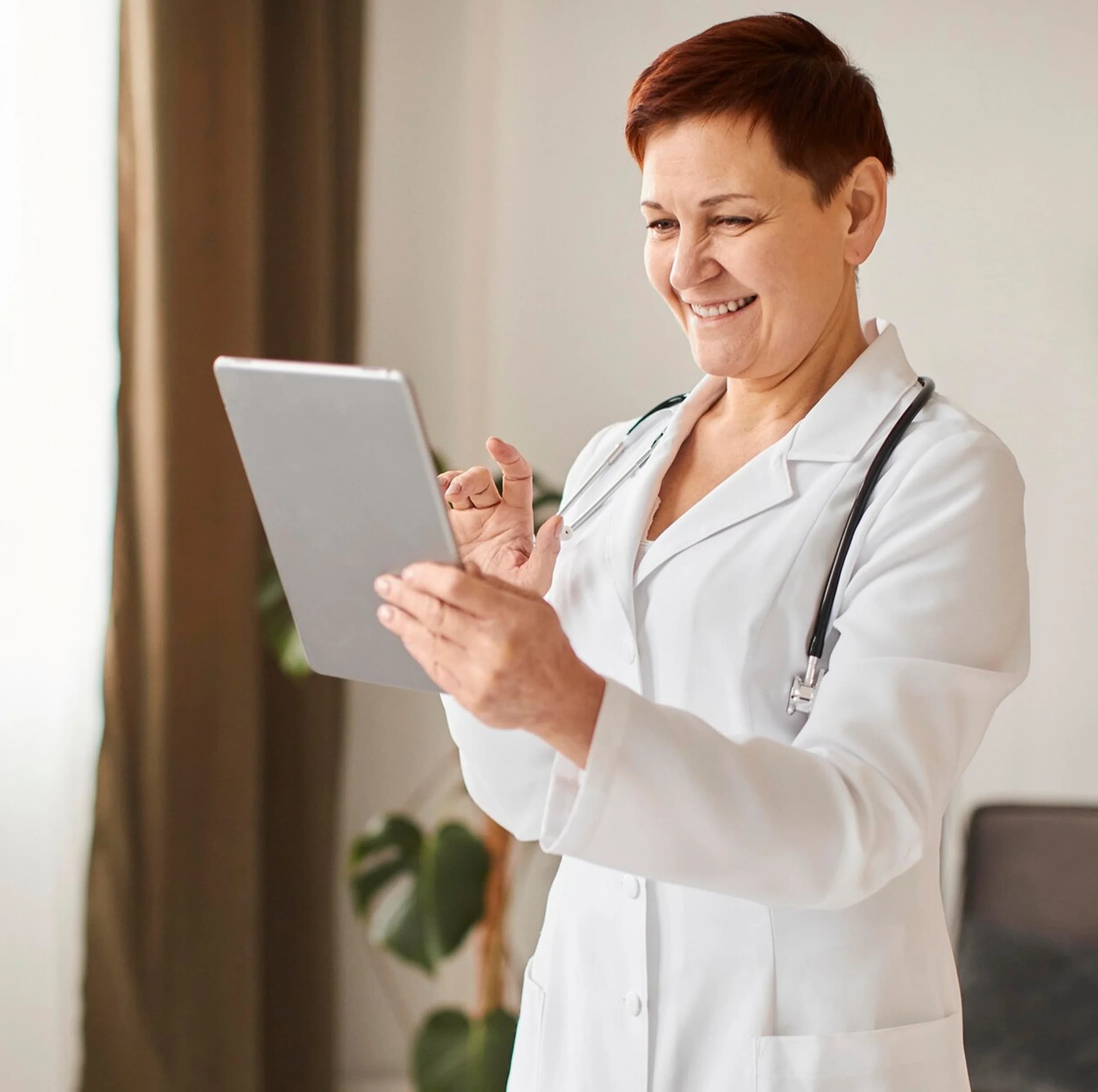 Provider utilizing connected care technology to care for her patients.