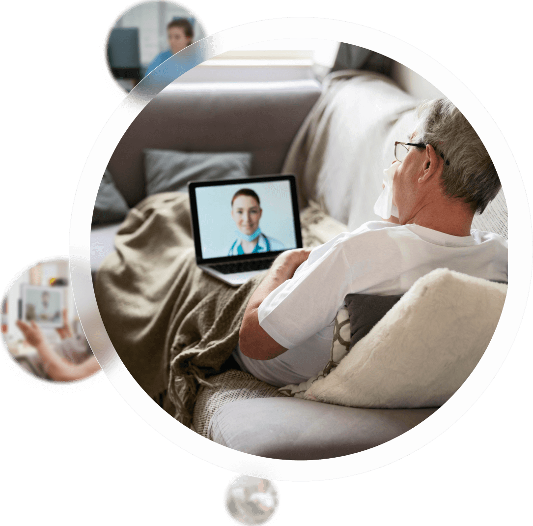 Clinical team collaborating during a GUIDE care coordination meeting, with one nurse standing at a laptop leading the discussion.