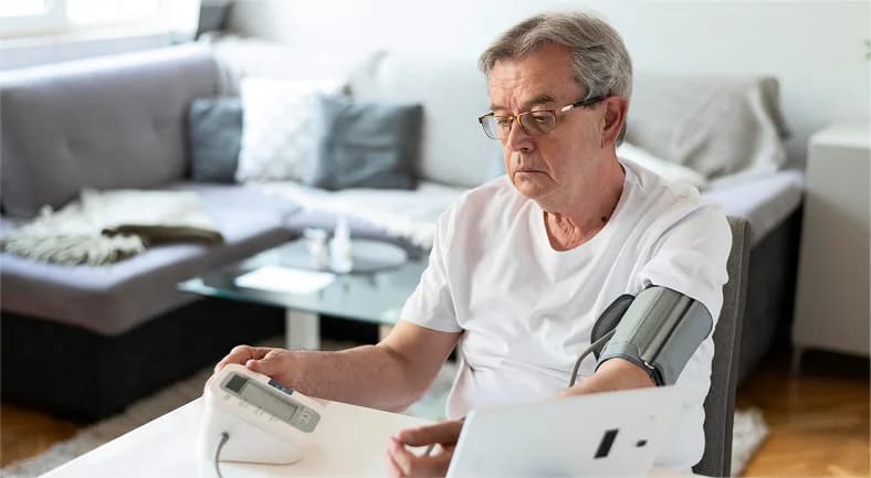 Patient starting RPM program and measuring blood pressure using a home monitoring devic