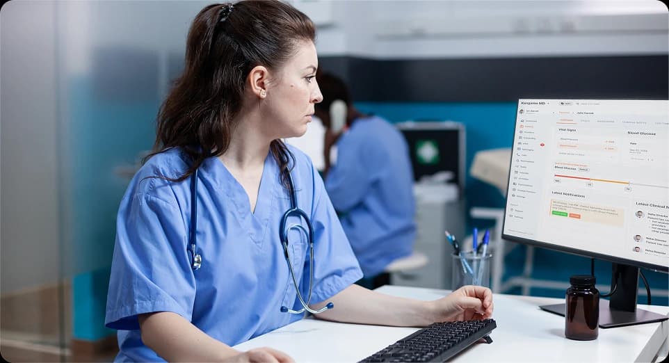 Clinician in busy care setting using KangarooHealth’s configurable platform tailored to clinical workflows.