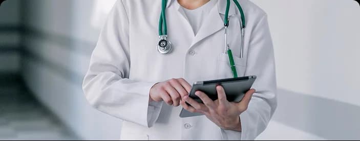 Clinician at desk supporting patient care.