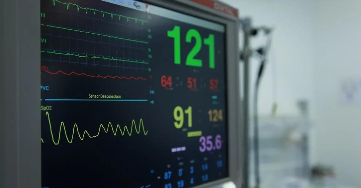 Medical monitor displaying vital signs and waveforms representing future of connected health technology in hospital.